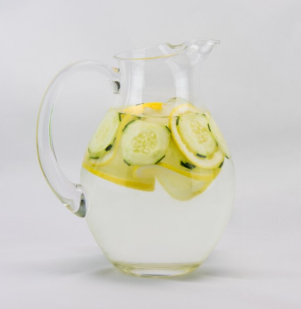 Photo close-up of water jug over white background