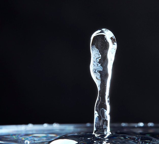 Close-up of water splashing against black background