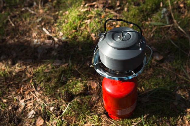 Photo close-up of watering can on field