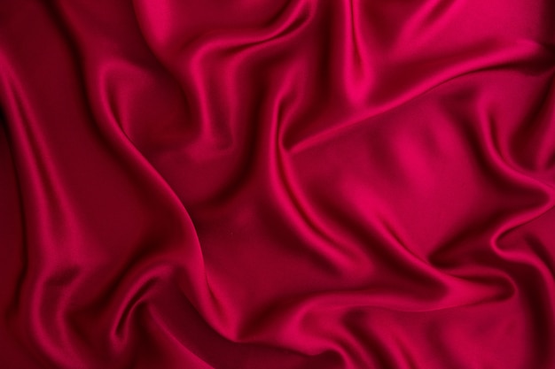 Close up wave red silk or satin fabric background