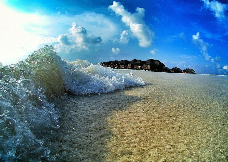 फोटो close-up of waves on beach against sky