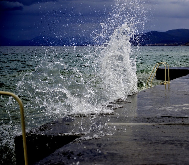 Close-up of waves in sea against sky