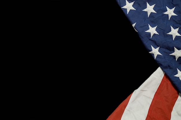 Close up of waving national usa american flag on black background.