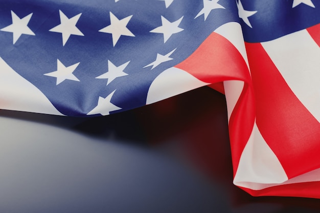 Close up of waving national usa american flag on a dark with copy space. Independence Day 4th July concept