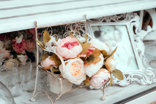 Close up wedding decoration bouquet of artificial flowers