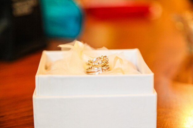 Close-up of wedding rings on table