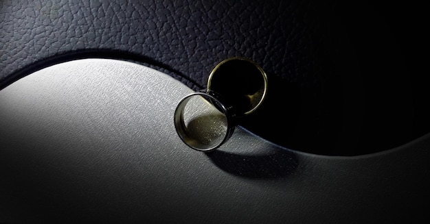 close-up of wedding rings on yin yang symbol