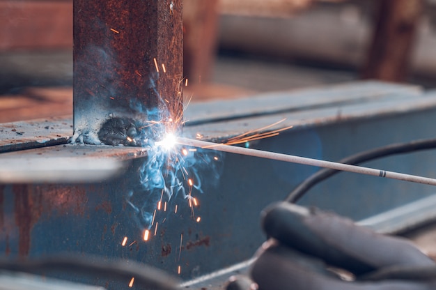 Photo close up welding sparks light, industrial