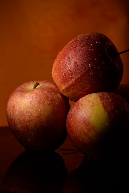 Close-up of wet apples on table