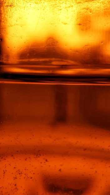 Photo close-up of wet glass window during sunset