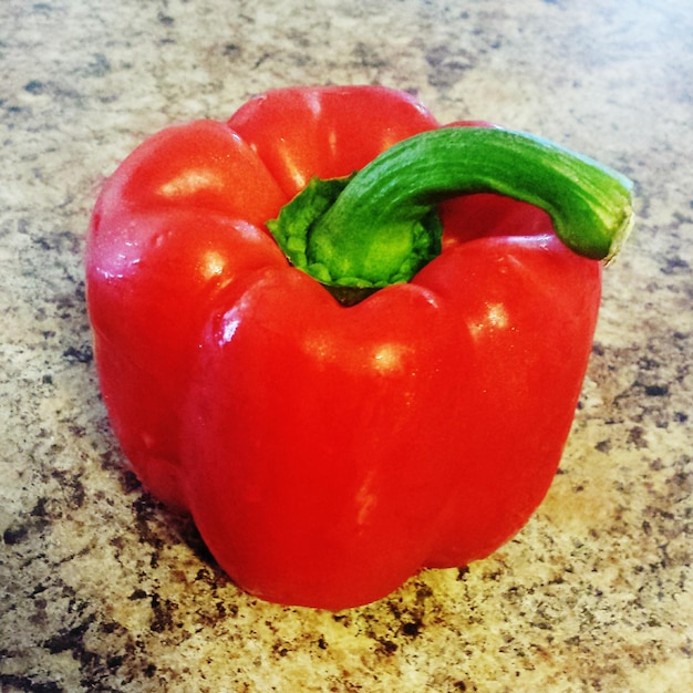 Close-up of wet red bell pepper on floor