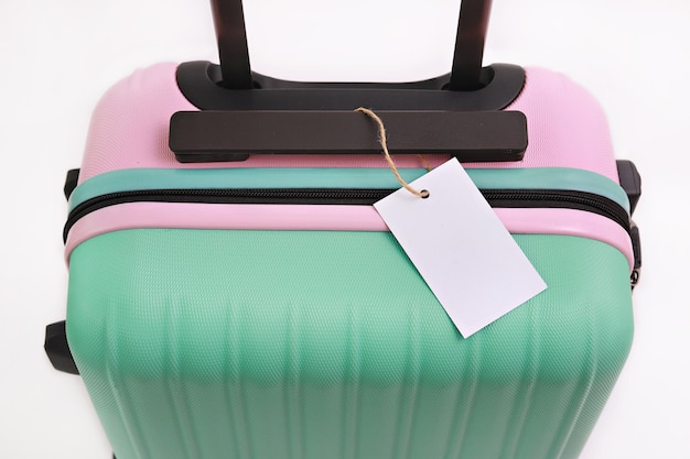 Photo close-up of wheeled luggage against white background