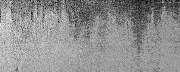 Close-up of White cement crack wall and peeled paint caused by water and sunlight. Peel wall of White house paint with black stain. Black and White of Texture background. 3D Rendering.