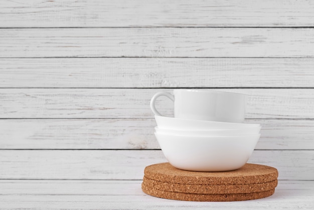 Close up of white ceramic bowls and cup