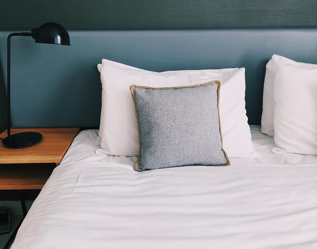 Close-up of white curtain on bed at home