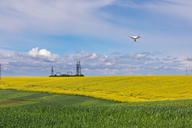 Close up on white drone camera. drone quadcopter in flight