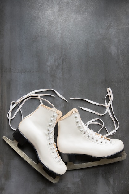 Close up of white figure ice skates