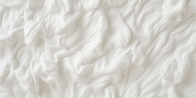 A close up of a white fuzzy blanket with a pattern of curls.