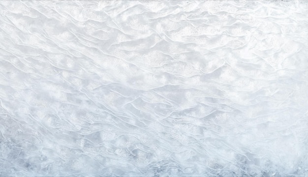 A close up of a white ice surface with a blue background.