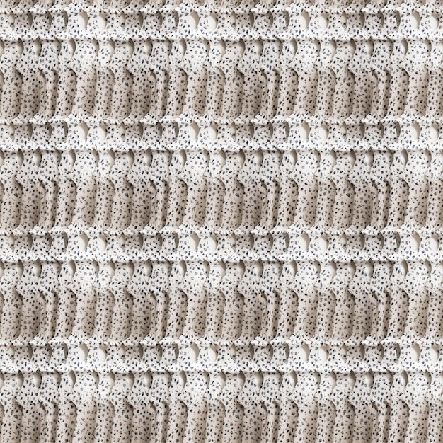 A close up of a white knitted blanket with a pattern of squares.