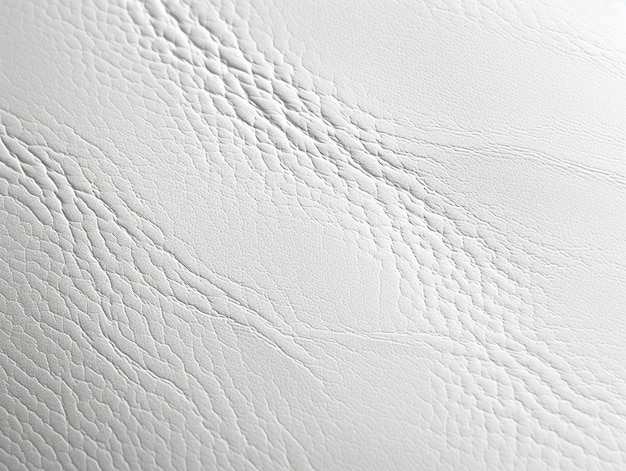 a close up of a white leather surface