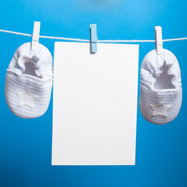 Photo close-up of white paper hanging against blue background