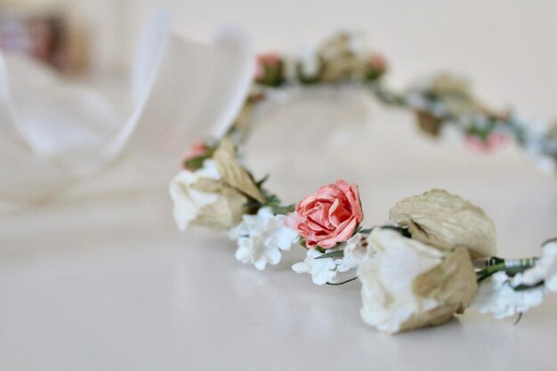 Close-up of white roses on table