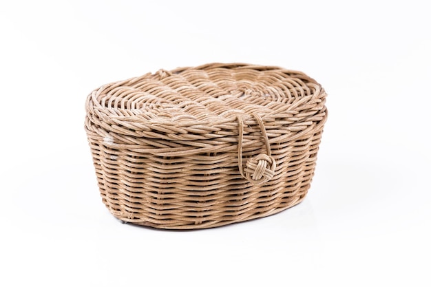 Photo close-up of wicker basket on white background