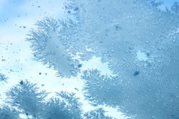 Photo close up of window with snow flakes