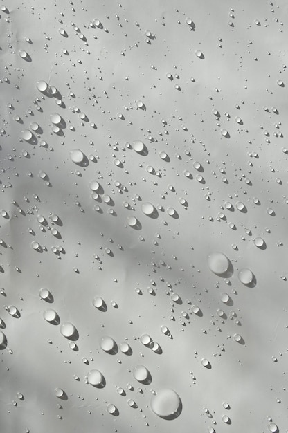 a close up of a window with water drops on it