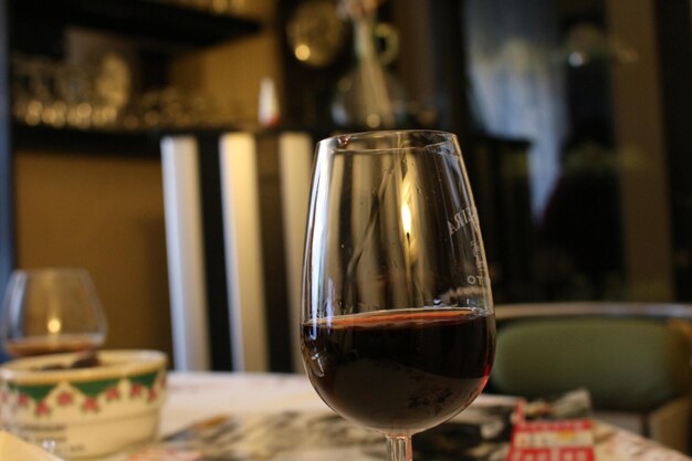 Close-up of wine in glass on table