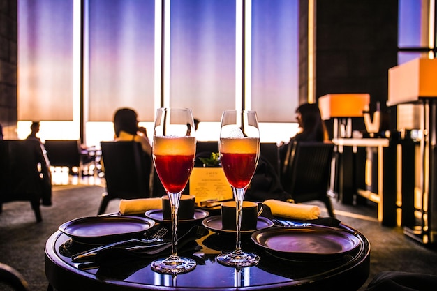 Close-up of wine glasses on table in restaurant