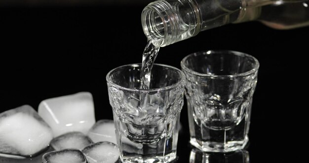 Close-up of wine glasses on table