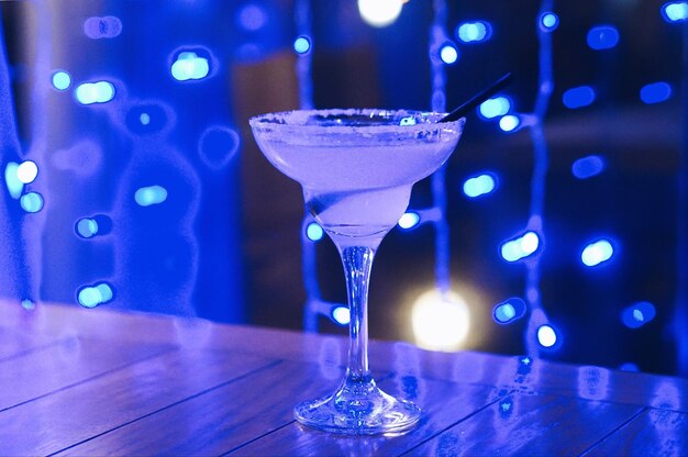 Close-up of wine glasses on table