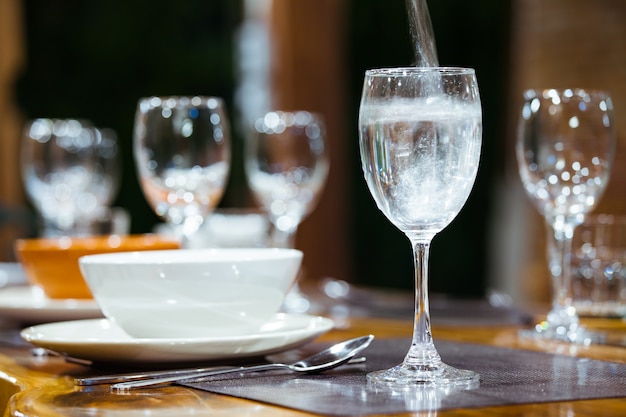 Close-up wine glasses on wooden table.