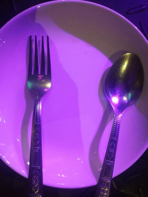 Close-up of wineglass in plate on table