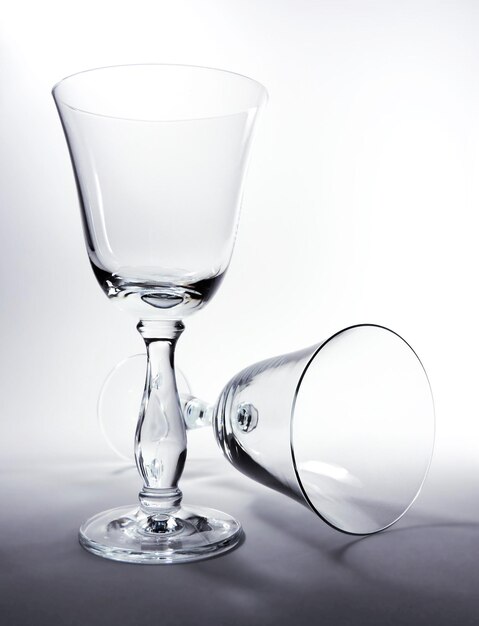 Photo close-up of wineglass on table against white background