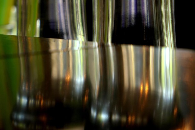 Close-up of wineglasses with reflection