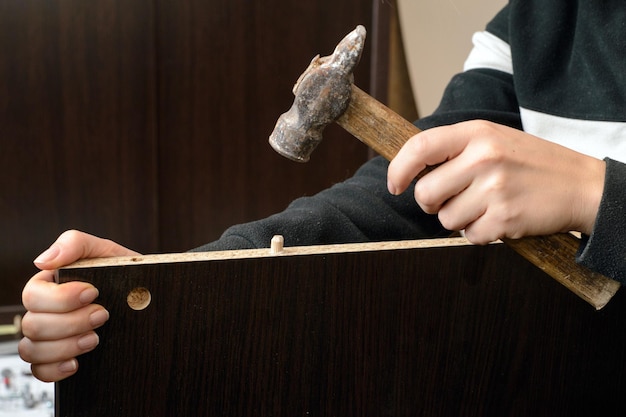 Close Up Of woman Assembling Furniture top view