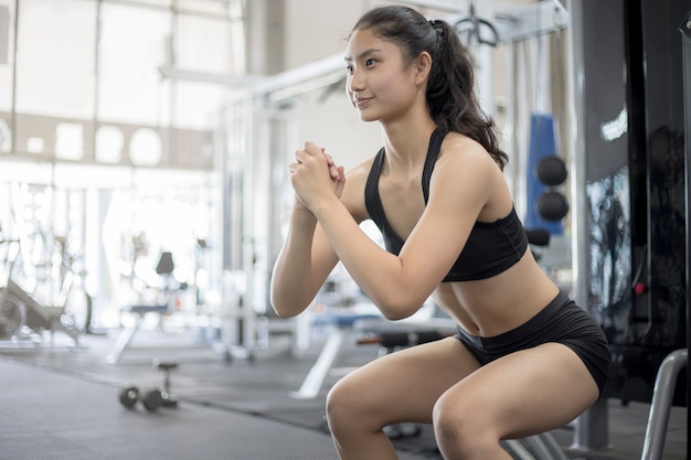 Close up of woman body with sport clothing in the fitness gy