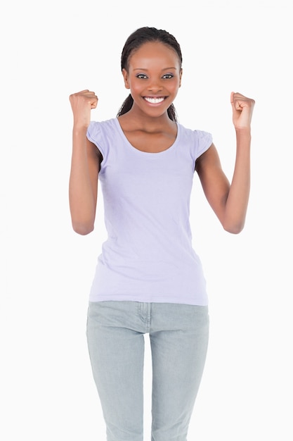 Photo close up of woman celebrating success on white background