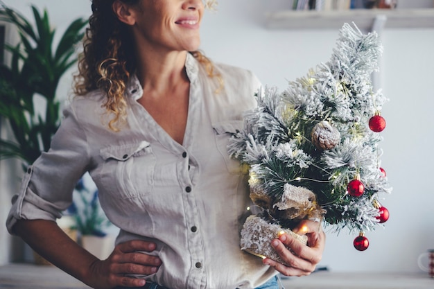 Close up of woman and christmas tree decoration