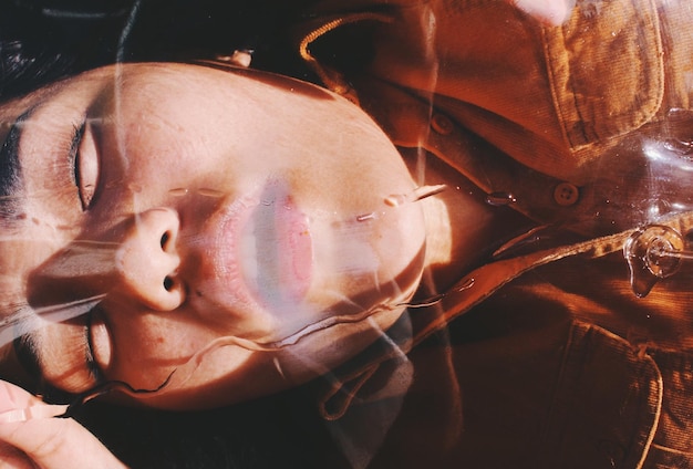 Photo close-up of woman covered with plastic