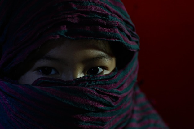 close-up of woman covering face