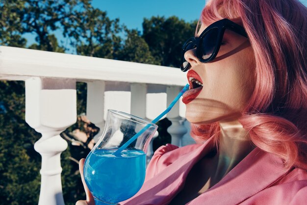 Close-up of woman drinking glass