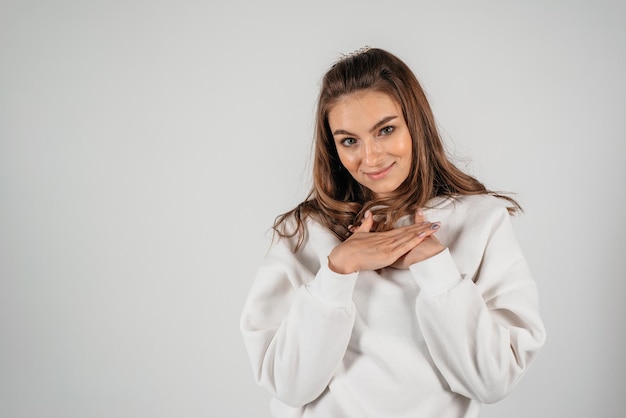 Close up woman face on the white background Portrait of smiling female model