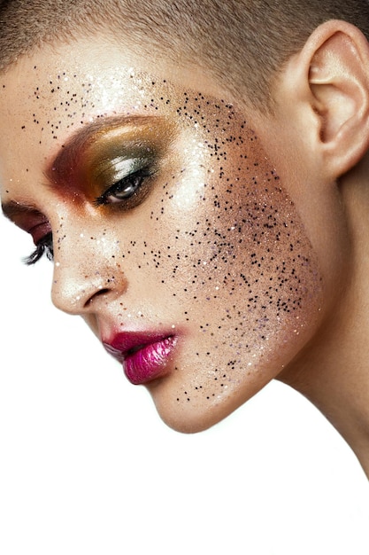 Close up of woman face with glitter on face