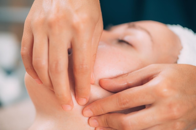 Close-up of woman getting massage therapy at spa