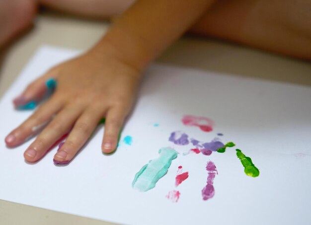 Photo close-up of woman hand on art color