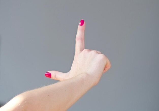 Close-up of woman hand over black background